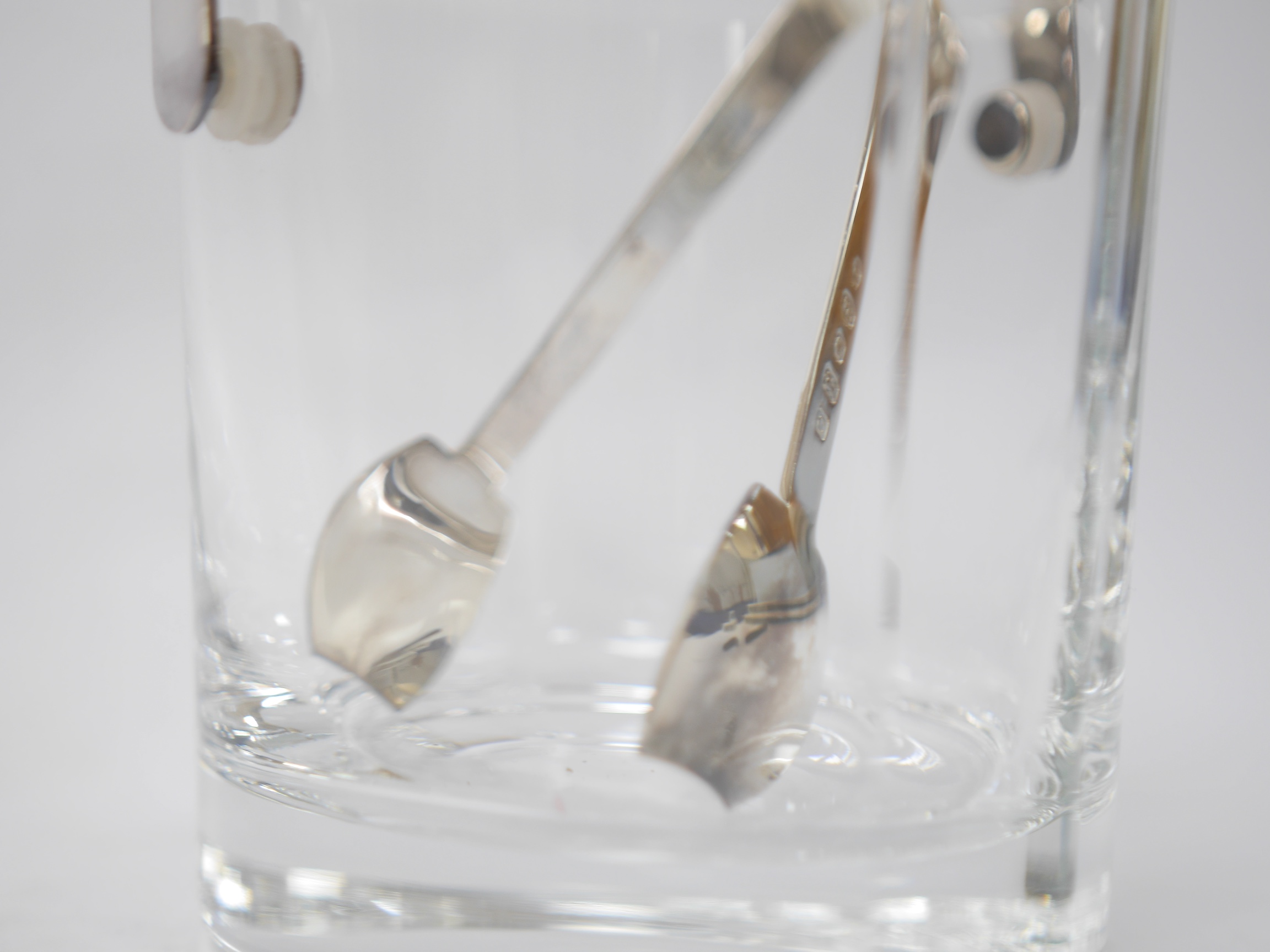 A modern silver handled glass ice bucket and a pair of silver tongs, by Carr's of Sheffield, Sheffield, 2002, height 12.4cm, Condition - good